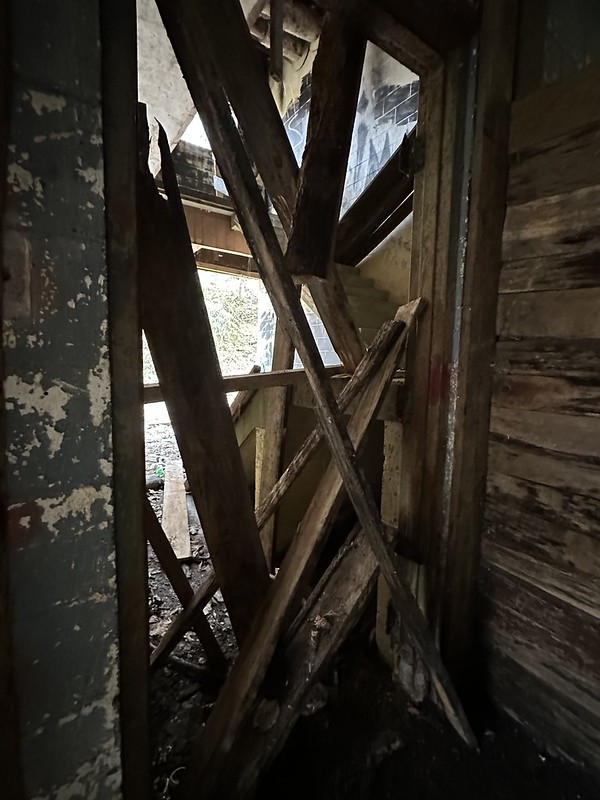 Wood blocking a doorway in Whitesburg Water Treatment Plant