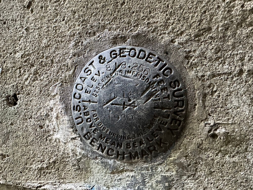 U.S. Coast and Geodetic Survey benchmark disk set in tunnel portal concrete near Tunnel Hill, documenting elevation used on USGS maps.