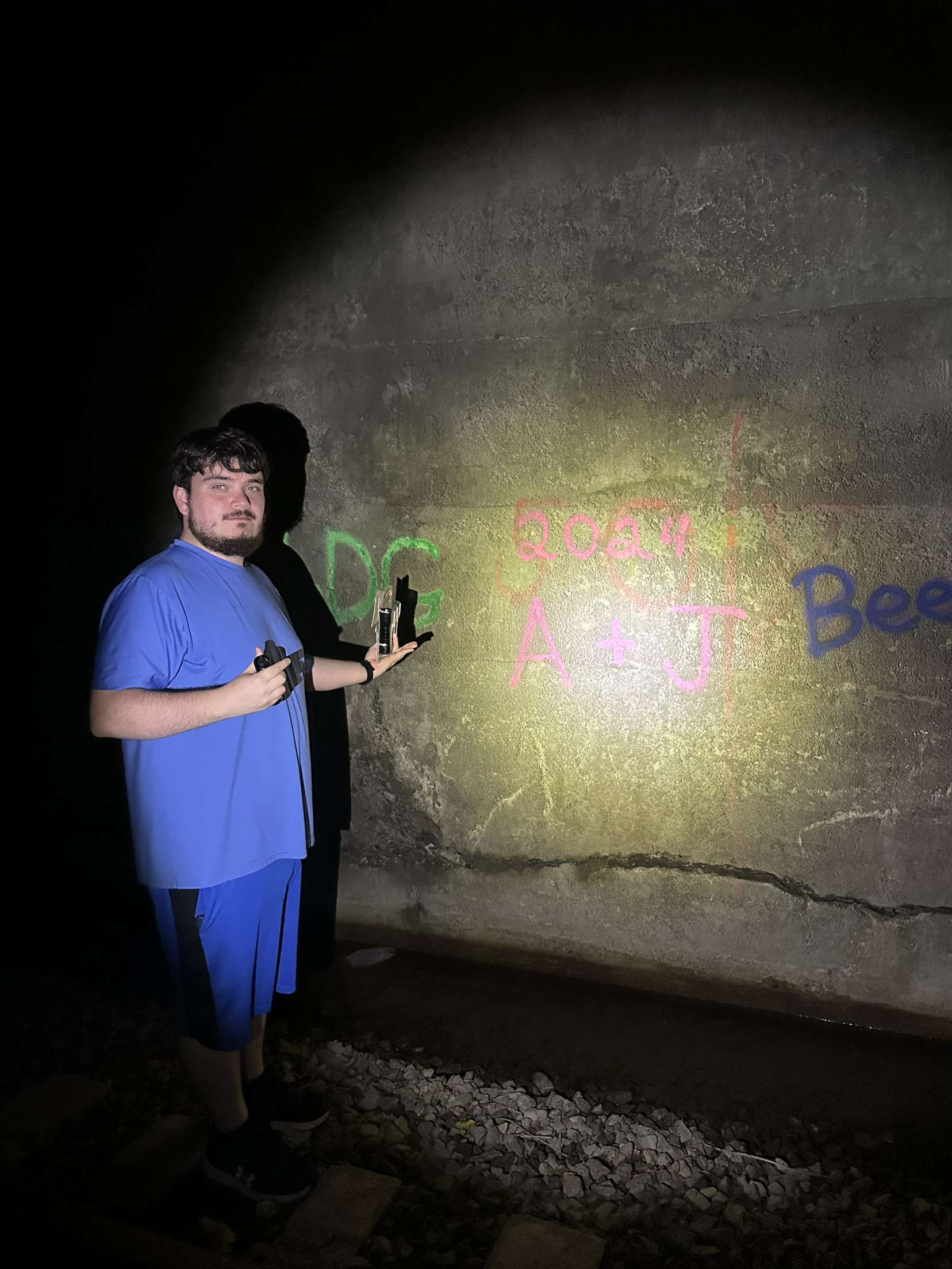 Picture of Alex Hall exploring a tunnel.